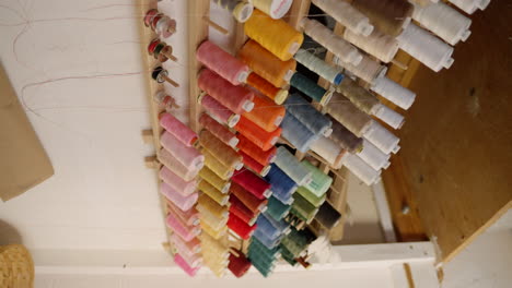 Cotton-thread-spool-on-the-wall-in-a-tailors-studio