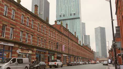 Old-buildings-in-a-shopping-street-versus-new-skyscrapers-in-the-background