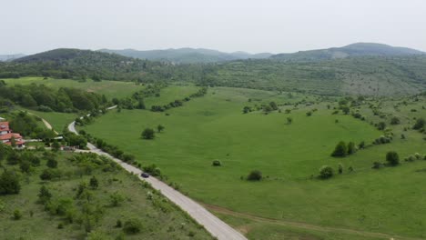 Approaching-drone-over-a-village-known-for-its-paranormal-sightings-in-Tsarichina-Hole,-also-called-Area-51-in-Bulgaria