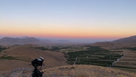 Photography-experience-in-mountain-highland-panoramic-landscape-view-of-wide-horizon-blue-sky-line-in-mountain-region-in-Esfahan-the-garden-orchard-field-green-hay-bale-fruit-tree-a-colorful-twilight