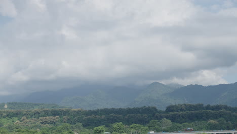 Static-scene-of-green-mountains-covered-by-rain-clouds