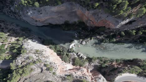 Aerial-top-down-of-pristine-Mijares-river-winding-in-narrow-canyon,-Aragon-Spain
