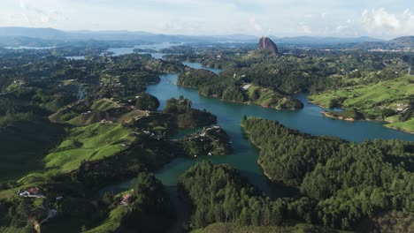 Rivers-through-Lush-Landscape-of-Guatape-Town-in-Colombia,-Establishing-Aerial