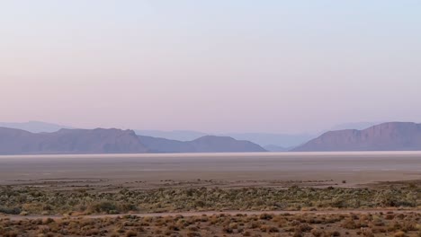 wonderful-pink-purple-color-of-twilight-after-sunset-in-horizon-before-night-in-desert-landscape-mountain-background-salt-lake-in-wide-view-of-sky-line-in-Iran-cold-peaceful-scenic-minimal-flat-scene