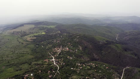 Drone-retreating-slowly-as-it-flies-above-Tsarichina-Village-known-for-its-extraterrestial-sightings-as-it-shows-the-expanse-of-the-Strandzha-Mountains-in-Bulgaria