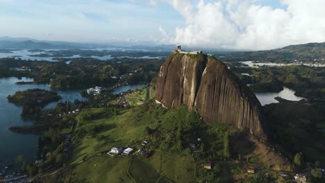 Guatape-Monolith-Mountain-at-Sunset,-Beautiful-Aerial-Drone-View