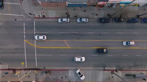 Aerial-Footage-of-Cars-Moving-Along-Busy-Street,-Ventura-Boulevard-Traffic-in-Daytime