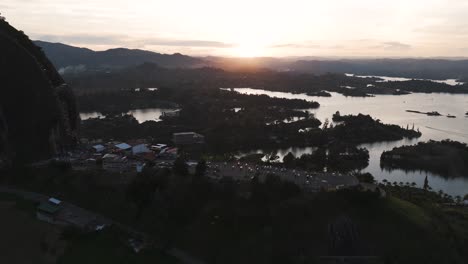 Sunset-by-El-Penon-de-Guatape,-Tourist-Attraction-in-Colombia,-Aerial