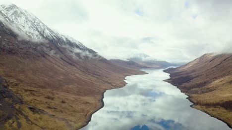 Ravine-of-glen-etive-with-snowy-mountains-during-cloudy-day