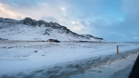 Snowy-mountain-range-viewed-from-driving-car-in-Iceland-on-Hringvegur-road