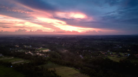 Hyperlapse-timelapse-of-sunset-with-bright-and-colorful-sky-over-Indonesian-Ubud-village,-Bali