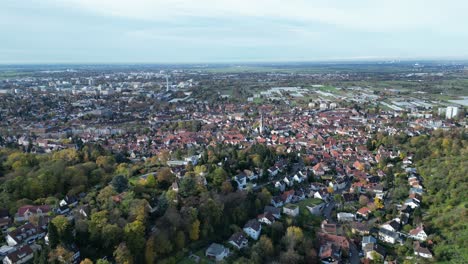 High-angle-Drone-shot-of-Handschuhsheim,-flying-above-town-pull-away-shot
