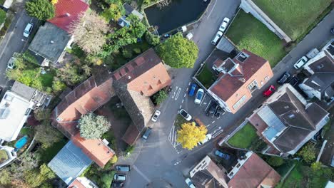 Top-down-aerial-drone-shot-flying-along-a-typical-street-in-Heidelberg