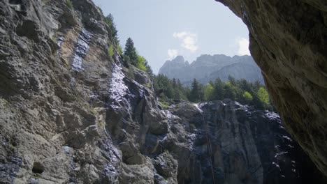 Water-On-Mountainside-Rocks-Of-Canyon-|-Grindelwald-Switzerland-Cave-in-Glacier-Canyon,-Europe,-4k
