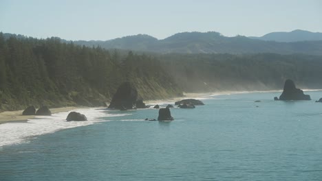 Port-Orford-Bay-rock-formations-near-shore-of-Oregon-during-day-time