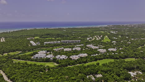 Akumal-Mexico-Aerial-v13-flyover-Riviera-Maya-Golf-Course-capturing-Gran-Bahia-Principe-luxury-complex-surrounded-by-jungle-nature-with-expansive-ocean-views---Shot-with-Mavic-3-Pro-Cine---July-2023