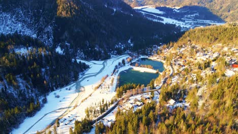 Aerial-4K-drone-footage-of-lake-Jasna,-Slovenia-in-the-winter