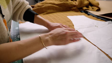 Clothing-making-pinning-sewing-pattern-templates-to-fabric