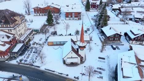 Picturesque-church-in-Kandersteg-town-in-winter-snow-in-Switzerland