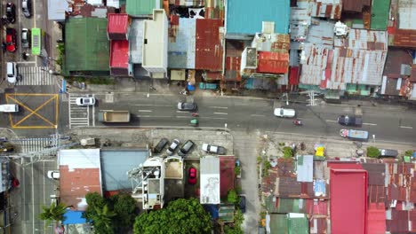 Aerial-top-down-view-of-traffic-transport-in-shanty-small-town-of-Philippines