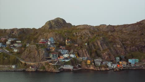 Colorful-homes-built-into-the-rocky-hillside-along-the-shore