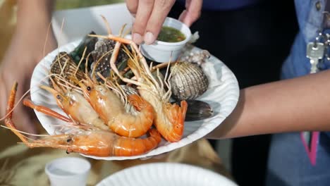Asian-Street-Vendor-Selling-Grilled-Seafood