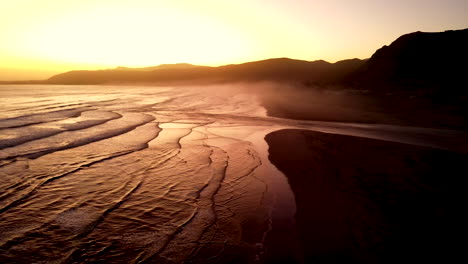 Golden-hour-aerial-view-over-Grotto-beach-with-Klein-River-mouth-breach
