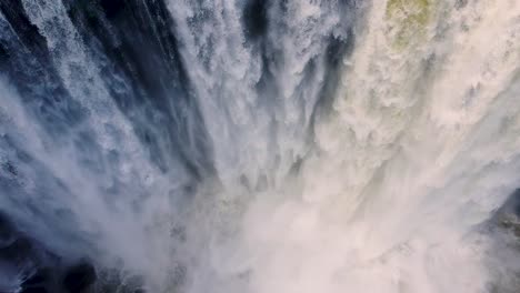 Dramatic-heavy-white-waterfall-crashing-into-river-below---Eyipantla-Falls