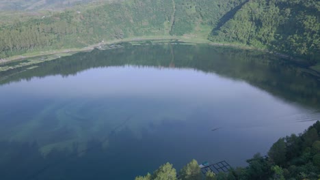 Aerial-view-of-A-large-crater-filled-with-water-and-became-a-lake