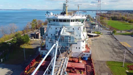 aerial-of-Great-Lakes-ore-bulk-lake-freighter-carrier-while-passing-through-locks-on-the-northern-Great-Lakes