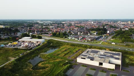 Aalst-cityscape-with-downtown-and-industrial-zone,-aerial-view
