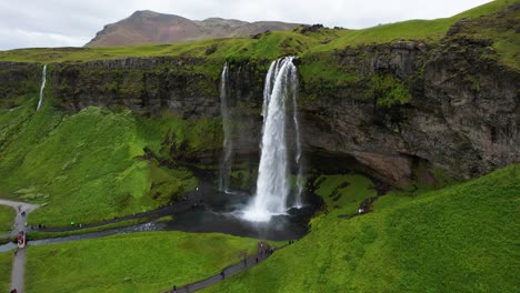 Static-establishing-view-of-strong-white-cascades-of-water-from-Seljalandsfoss-waterfall