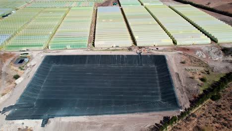 Empty-Water-Basin-For-Irrigation-Of-Greenhouse-Farm