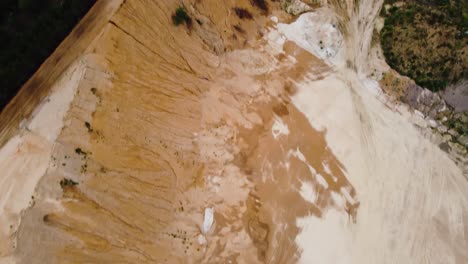 Sand-quarry-landscape-with-massive-piles-and-woodland-landscape