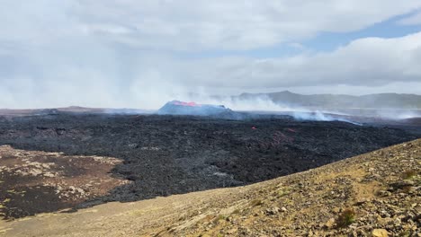 Slowly-smoking-Fagradalsfjall-volcano-erupting-lava-field-on-Iceland-extreme-terrain