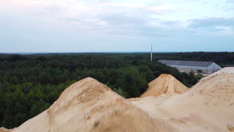 Raw-sand-material-local-quarry,-close-up-fly-over-view