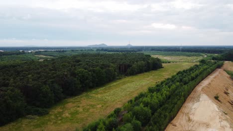 Woodland-landscape-and-quarry-area,-aerial-drone-view