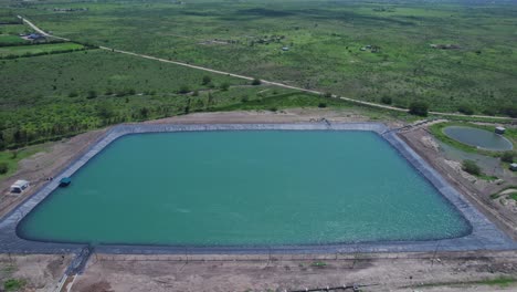 Aerial-View-Of-Artificial-Irrigation-Basin-With-Pond-Lining-In-Africa