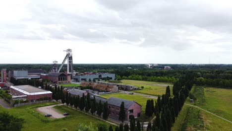 Industrial-facilities-surrounded-with-woodlands,-aerial-drone-view