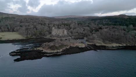 Dunvegan-castle-on-the-isle-of-skye,-surrounded-by-woodlands-and-water,-aerial-view