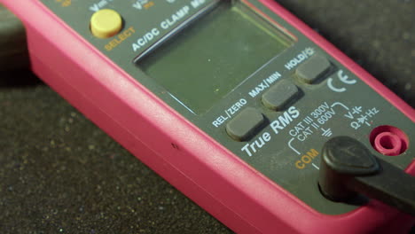 Closeup:-Electrodes-are-connected-to-multimeter-tool-and-its-turned-on