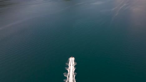 Cinematic-Aerial-Video-Of-Navigating-Speed-Boat-In-The-Bay-Of-Kotor-At-Full-Speed