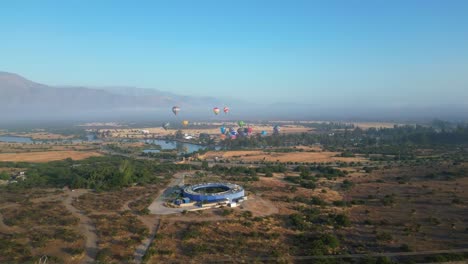 hot-air-balloon-festival-flying-in-Laguna-Caren-Chile