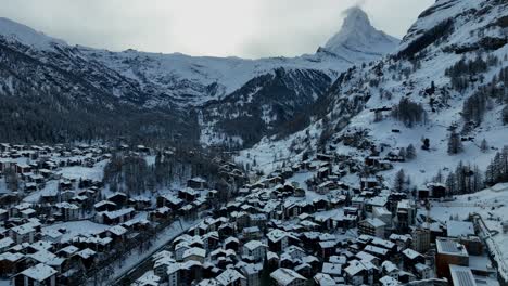 Zermatt-ski-resort-and-town-with-the-matterhorn-and-houses-in-the-back-ground-on-a-cloudy-winter-day-in-the-Swiss-Alps-mountains