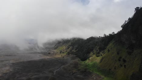 Cloud-billows-over-volcanic-ash-caldera-at-Mt-Bromo-in-Java,-Indonesia