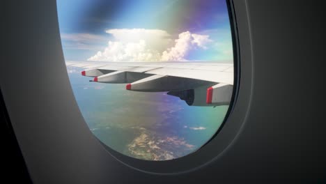 Looking-out-passenger-plane-window-in-flight-reveals-an-expansive-panorama-of-the-skies,-where-billowing-clouds-stretch-as-far-as-the-eye-can-see,-traveling-and-air-transportation-concept