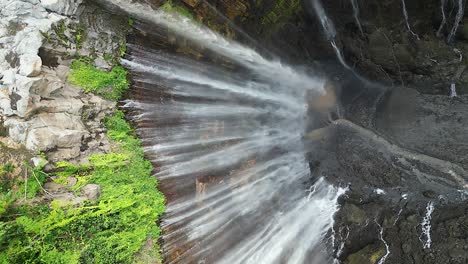 Vertical-format:-Stunning-Tumpak-Sewu-waterfall-in-tall-Java-canyon