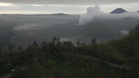 Convoy-of-tourism-trucks-on-twisted-mtn-road-near-Mt-Bromo-on-Java