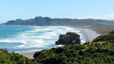 Waves-and-a-beach-at-the-Tepuhueico-Park-Coast-Zone,-sunny-day-in-Chiloé,-Chile