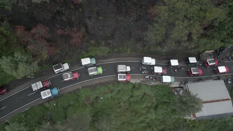 Overhead-view-of-trucks-in-traffic-jam-on-mountain-road-on-Java,-IDN